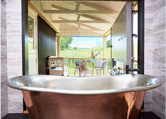 glamping with copper roll top bath