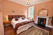 Open fire in bedroom at Cardhu House